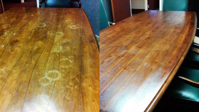 Lawyers’ conference table, before and after restoration: water stains across the top, then refinished.
